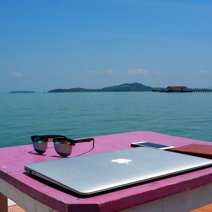 image of a laptop by the ocean a vpn will keep your data safe